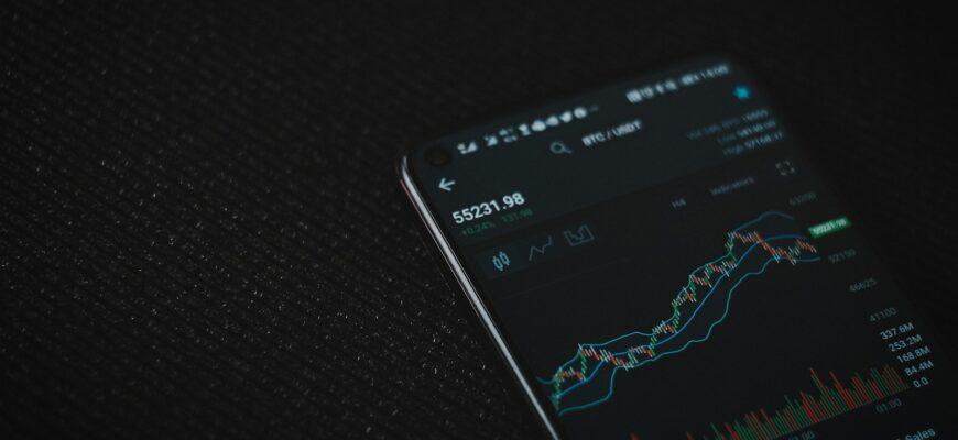 black android smartphone on black textile