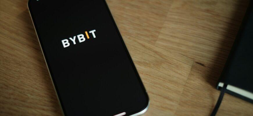 A cell phone sitting on top of a wooden table