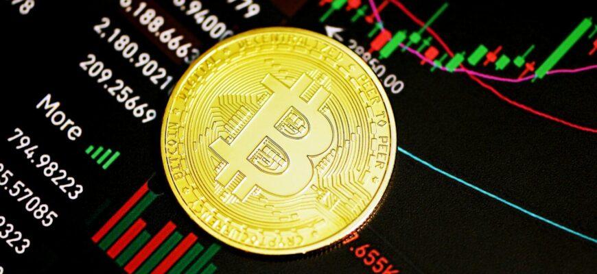 gold round coin on black surface