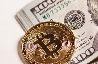 a bitcoin sitting on top of a pile of money