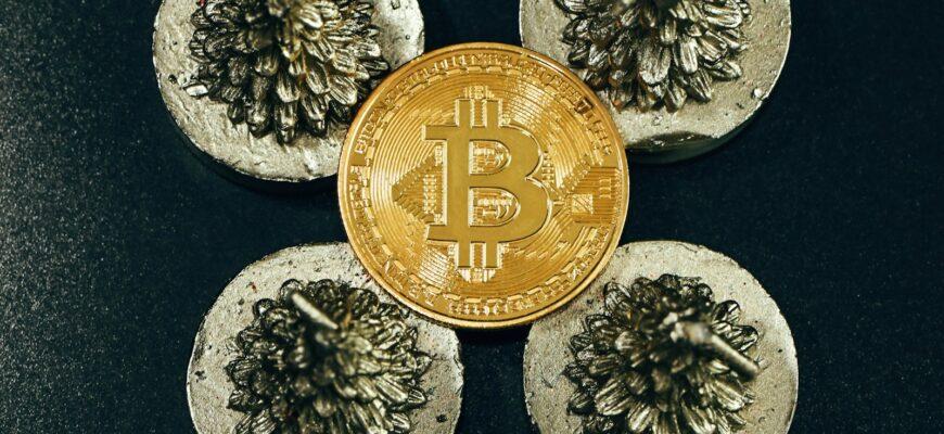 a bit coin sitting on top of some rocks